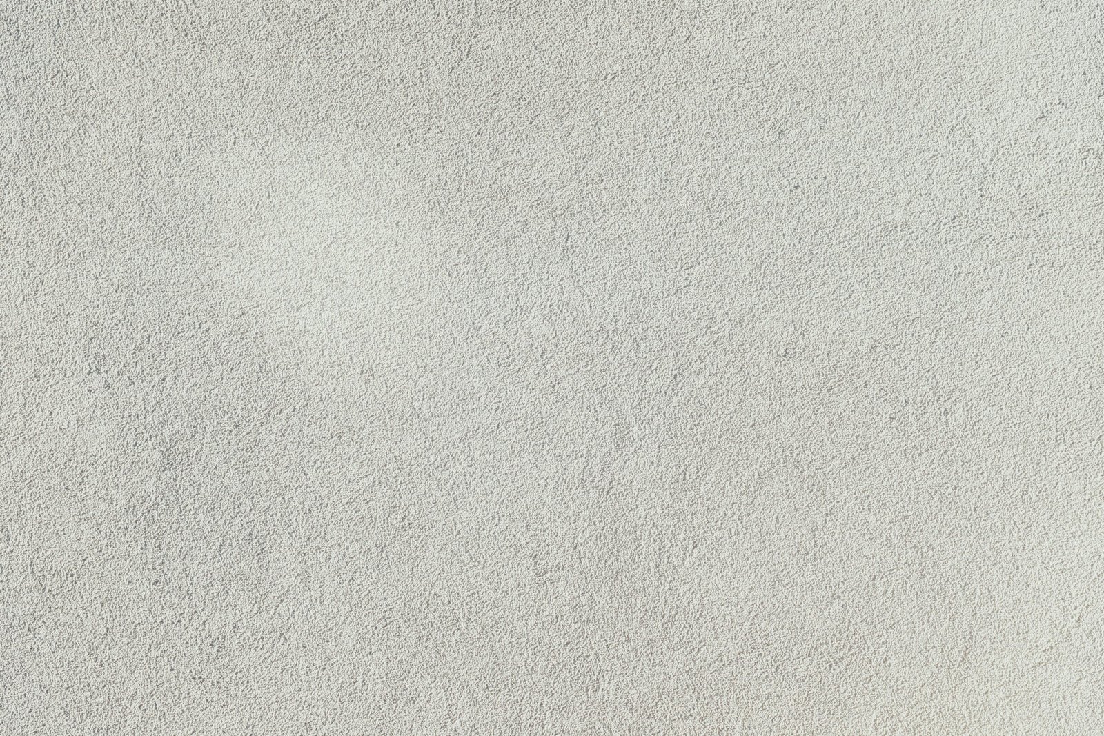 a close up of a white stucco wall